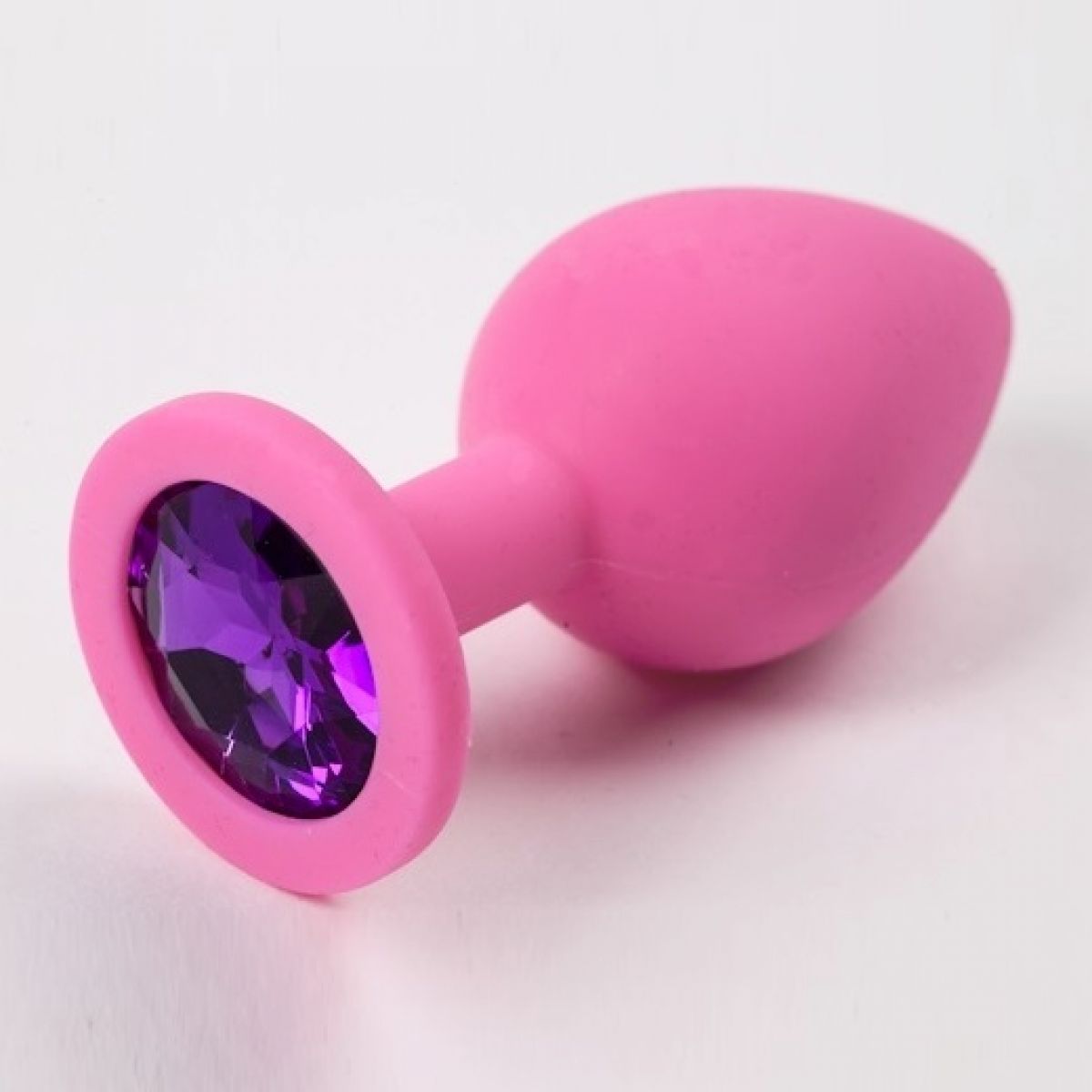 Розовая силиконовая пробка S с фиолетовым стразом