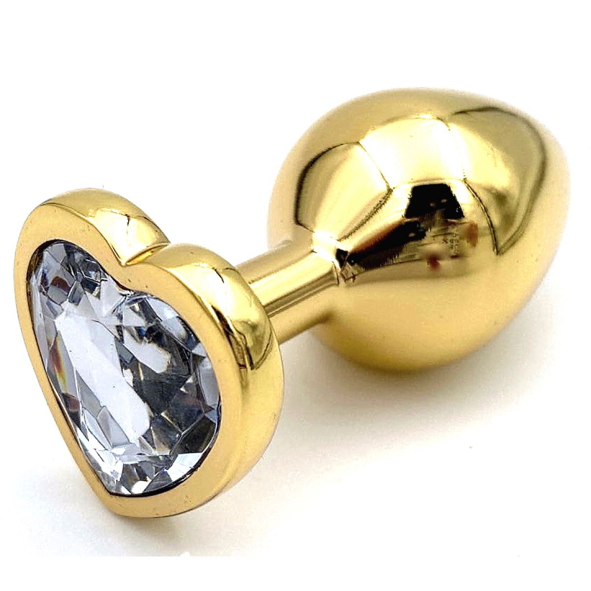 Золотая металлическая анальная пробка S с прозрачным камушком в виде сердечка