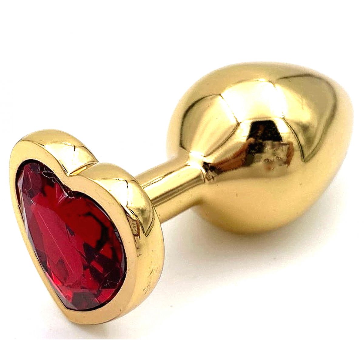 Золотая металлическая анальная пробка с красным камушком в виде сердечка S