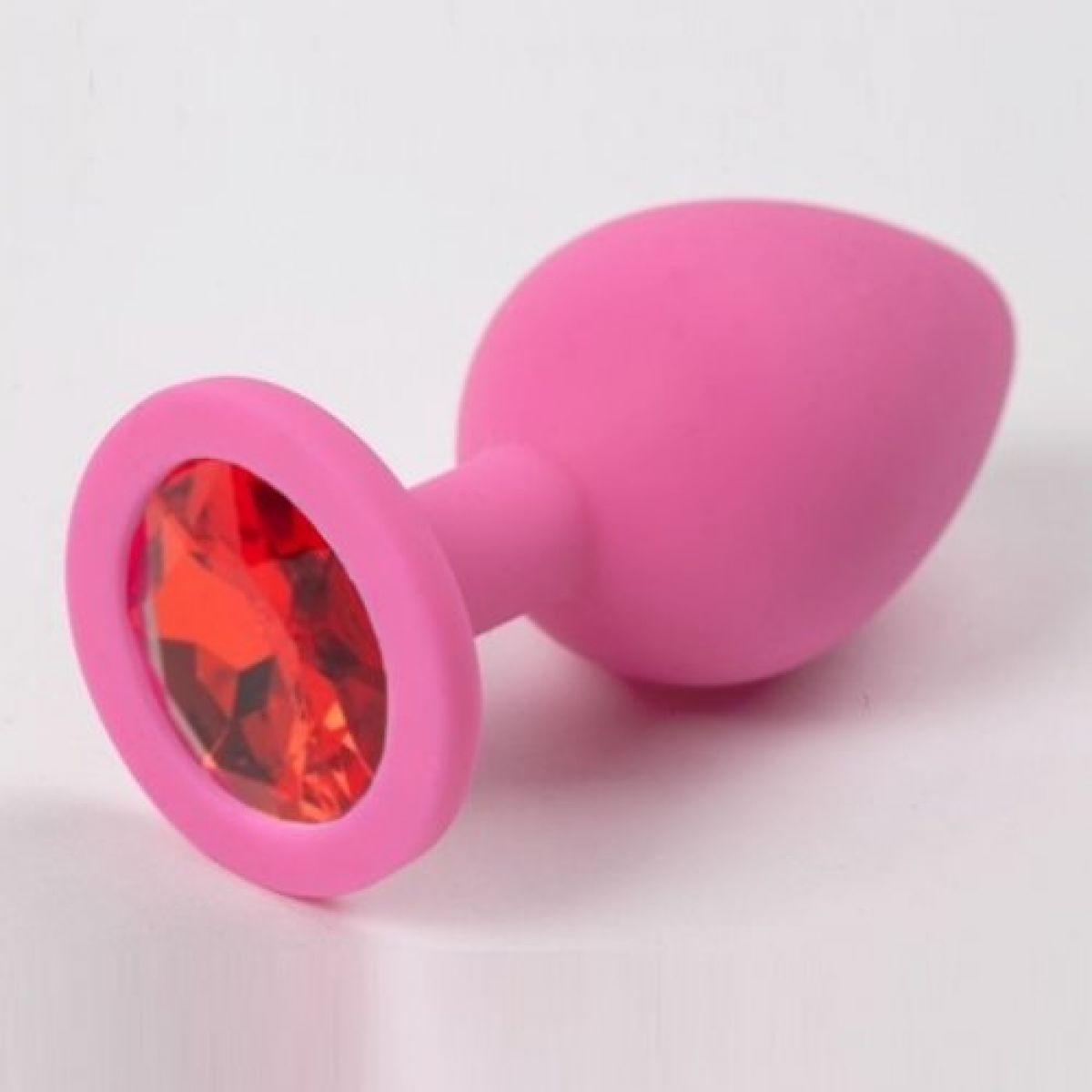 Розовая силиконовая пробка M с красным стразом